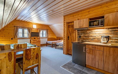 Chalupa U Bobra 55.3: Cabinetry, Furniture, Wood, Countertop, Architecture, Table, Interior Design, Wood Stain, Kitchen, Floor