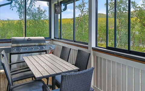 Willa Kiiruna: Furniture, Porch, Glass, Chair, Balcony, Outdoor Furniture, Metal, Shade, Deck, Hardwood