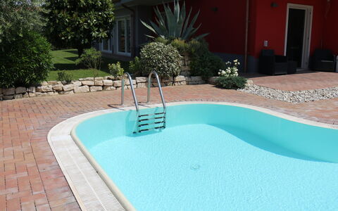 Corte Chiara: Water, Plant, Window, Azure, Swimming Pool, Building, Rectangle, Grass, Door, Composite Material