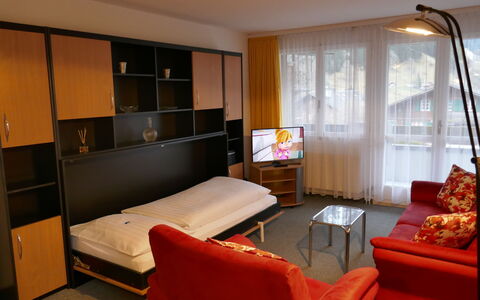 Chalet Wyssefluh: Furniture, Property, Picture Frame, Comfort, Cabinetry, Television, Interior Design, Table, Window, Flooring