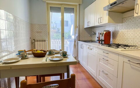 Letizia: Kitchen Appliance, Kitchen, Major Appliance, Countertop, Flooring, Interior Design, Wood, Furniture, Cabinetry, Home Appliance