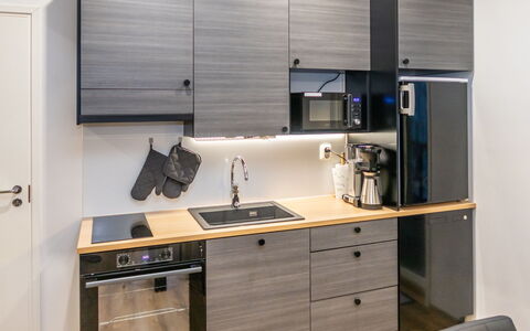 Saukonpesä B: Kitchen, Kitchen Appliance, Furniture, Countertop, Wood, Major Appliance, Cabinetry, Interior Design, Home Appliance, Flooring