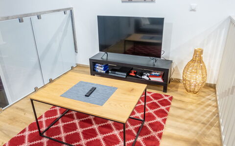 Saukonpesä B: Furniture, Flooring, Floor, Wood, Interior Design, Wood Flooring, Lighting, Table, Room, Living Room
