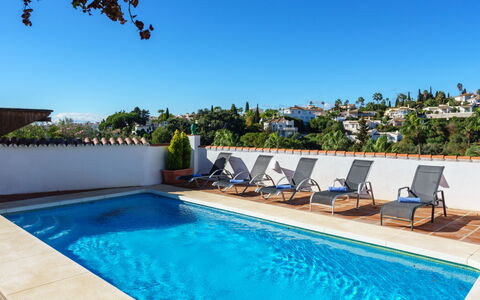 Luna: Water, Plant, Sky, Property, Swimming Pool, Azure, Shade, Outdoor Furniture, Tree, Chair