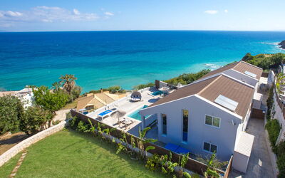 Bouka Villas: Water, Sky, Plant, Cloud, Building, Property, Window, Blue, Azure, House