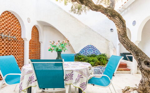 Los Abuelos: Table, Plant, Furniture, Building, Chair, Azure, Outdoor Furniture, Flower, Flowerpot, Interior Design