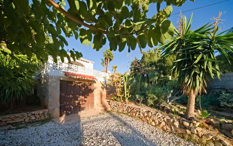 Villa Carmen: Sky, Building, Plant, Window, Tree, Urban Design, Residential Area, Asphalt, Wheel, Road Surface