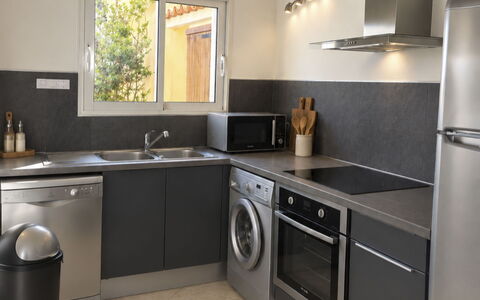 Villa Orizonte: Kitchen Appliance, Kitchen, Countertop, Major Appliance, Home Appliance, Kitchen Stove, Furniture, Cabinetry, Interior Design, Washing Machine