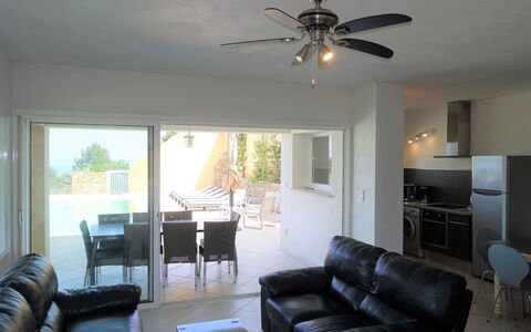 Villa Orizonte: Property, Furniture, Couch, Ceiling Fan, Table, Lighting, Interior Design, Architecture, Shade, Floor
