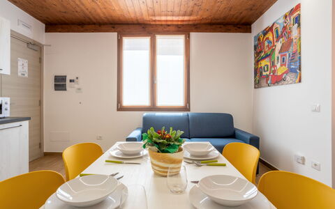 Balestrate 215: Table, Tableware, Furniture, Property, Dishware, Plant, Orange, Interior Design, Lighting, Plate