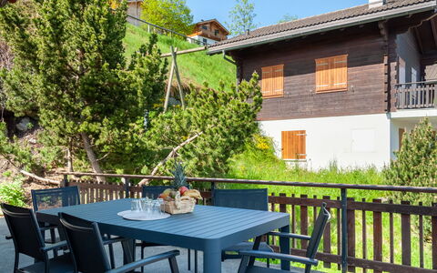 Anusach: Table, Plant, Building, Property, Furniture, Sky, Window, Chair, Outdoor Table, Tree