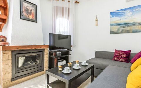 Villa Barcelona: Picture Frame, Property, Furniture, Table, Orange, Interior Design, Couch, Wood, Living Room, Comfort
