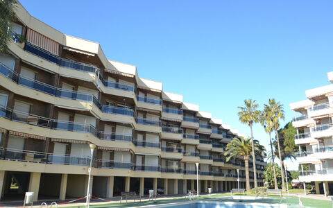 Sol España: Building, Sky, Property, Water, Plant, Window, Azure, Swimming Pool, Tree, Condominium