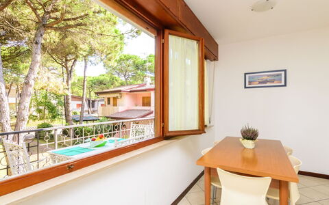 Lignano Pineta 678: Table, Property, Building, Sky, Window, Wood, Interior Design, Cloud, Lighting, Outdoor Furniture