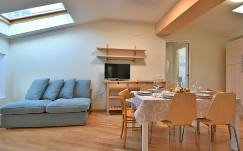 Duomo Mansarda: Furniture, Property, Table, Couch, Chair, Building, Wood, Interior Design, Flooring, Window