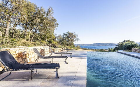 Le Mas du Golfe: Water, Plant, Sky, Property, Nature, Azure, Swimming Pool, Tree, Vegetation, Grass