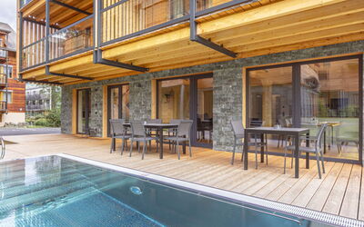# 3A mit Sauna & Pool 180.4: Sky, Building, Property, Table, Furniture, Cloud, Mountain, Interior Design, Outdoor Furniture, Wood