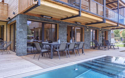 #2A mit Sauna & Pool 180.7: Sky, Building, Property, Table, Furniture, Cloud, Mountain, Interior Design, Outdoor Furniture, Wood