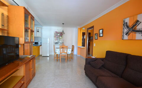 Sevilla: Furniture, Property, Cabinetry, Wood, Living Room, Orange, Interior Design, Picture Frame, Couch, Architecture
