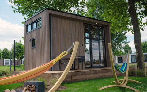 Tiny River House: Water, Building, Sky, Cloud, Daytime, Property, Plant, Light, Nature, Green