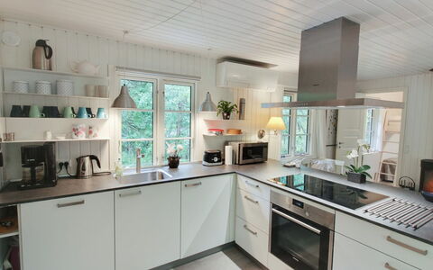 Tume - 200M from the Sea: Kitchen, Countertop, Kitchen Appliance, Interior Design, Cabinetry, Flooring, Major Appliance, Wood, Furniture, Home Appliance
