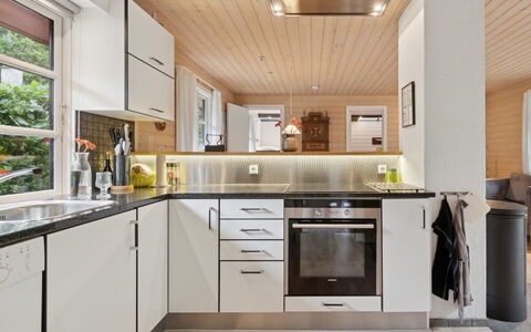 Nahuel - 200M from the Sea: Kitchen, Countertop, Kitchen Appliance, Flooring, Interior Design, Major Appliance, Wood, Cabinetry, Furniture, Ceiling