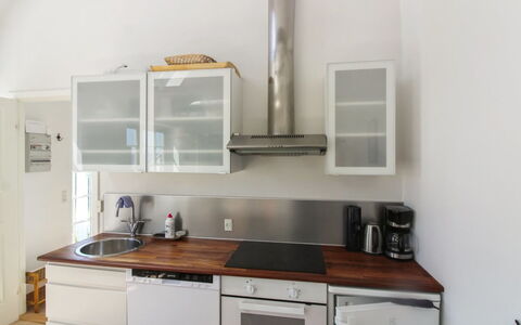 Tinne - 400M from the Sea: Kitchen, Countertop, Kitchen Appliance, Flooring, Interior Design, Cabinetry, Wood, Furniture, Major Appliance, Floor