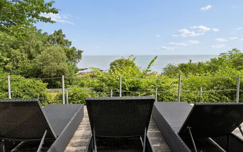 Ensio - 150M from the Sea: Cloud, Outdoor Furniture, Chair, Fence, Shade, Hardwood, Deck, Balcony, Handrail, Cumulus
