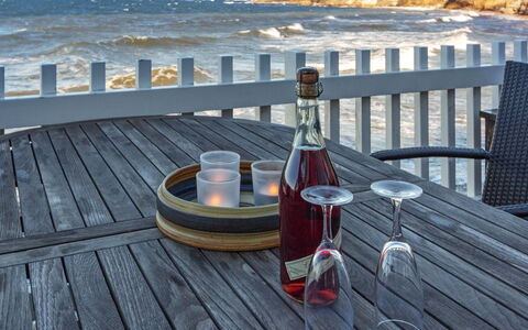 Halldora - 10M from the Sea: Furniture, Sea, Table, Coast, Cloud, Barware, Coastal And Oceanic Landforms, Ocean, Chair, Drinkware