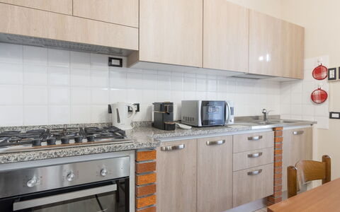 La Masina: Cabinetry, Property, Countertop, Kitchen Stove, Kitchen, Kitchen Appliance, Home Appliance, Cooktop, Stove, Wood