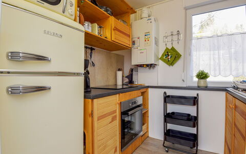 Anna: Cabinetry, Countertop, Furniture, Building, Kitchen, Kitchen Appliance, Kitchen Stove, Wood, Home Appliance, Interior Design