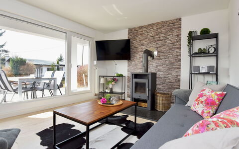 Anna: Couch, Furniture, Property, Table, Plant, Picture Frame, Interior Design, Floor, Houseplant