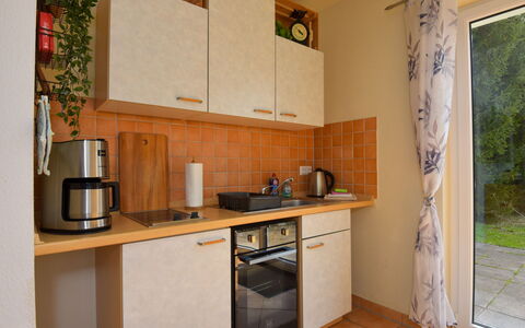 Konrad: Kitchen Sink, Property, Cabinetry, Countertop, Kitchen Appliance, Sink, Building, Kitchen, Kitchen Stove, Wood