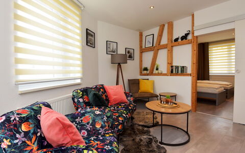 Carola: Furniture, Window Blind, Property, Couch, Window, Comfort, Orange, Interior Design, Lighting, Wood