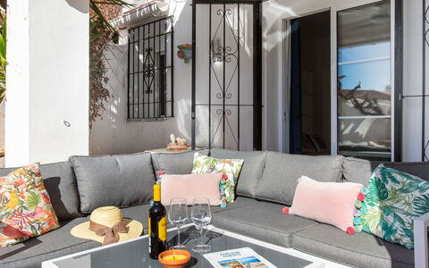 Capuchinos San Juan de Capistrano: Table, Couch, Furniture, Property, Green, Living Room, Interior Design, Studio Couch, Orange, Plant