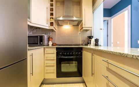 Salou 705: Countertop, Cabinetry, Furniture, Kitchen Stove, Kitchen, Wood, Kitchen Appliance, Building, Interior Design, Architecture