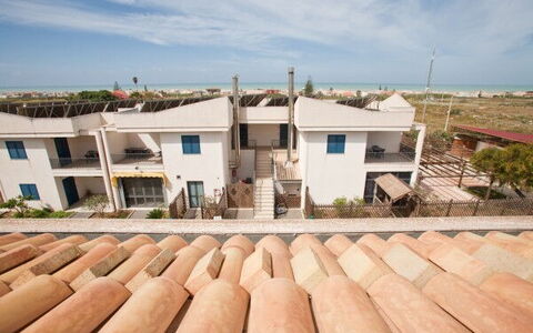 Baraka Apartments: Sky, Cloud, Property, Building, Window, Wood, Residential Area, Real Estate, Landscape, Roof