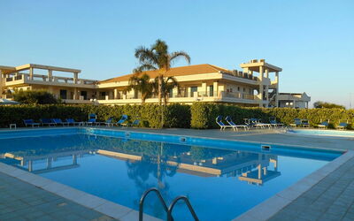 Baraka Apartments: Water, Sky, Plant, Building, Property, Swimming Pool, Azure, Window, Tree, Outdoor Furniture