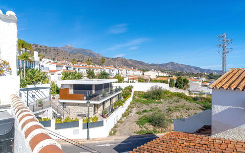 Perla del Mar: Sky, Building, Daytime, Property, Urban Design, Tree, Neighbourhood, Residential Area, Mountain, Leisure