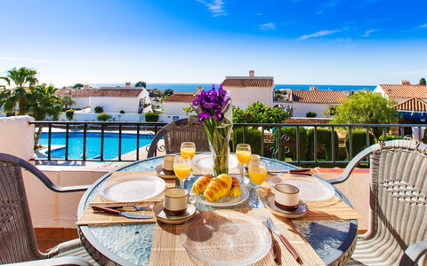 Perla del Mar: Sky, Water, Table, Furniture, Property, Tableware, Plant, Cloud, Azure, Chair