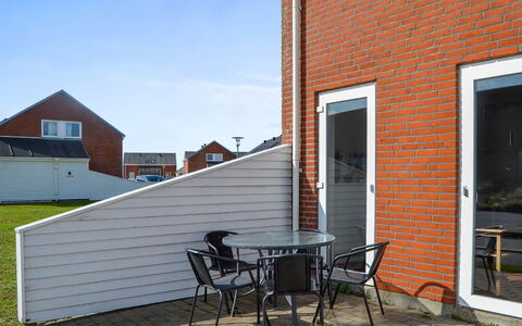 Gaida - 2.3Km from the Sea: Brick, Composite Material, Outdoor Furniture, Siding, Brickwork, Door, Chair, Outdoor Table, Wood Stain