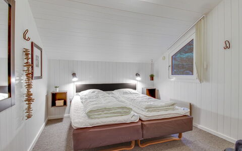 Jensen - 700M to the Fjord: Wood, Ceiling, Bedroom, Interior Design, Bed, Home, Bed Sheet, Bedding, Room, Bed Frame