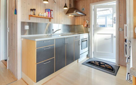 Maika - 800M to the Fjord: Kitchen, Countertop, Flooring, Kitchen Appliance, Wood, Major Appliance, Interior Design, Cabinetry, Floor, Furniture