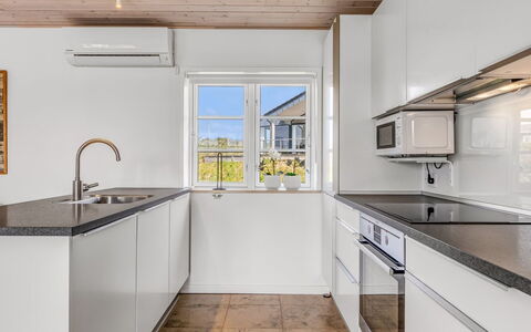 Mikka - 450M from the Sea: Flooring, Kitchen, Floor, Countertop, Interior Design, Ceiling, Cabinetry, Kitchen Sink, Home, Wood Flooring