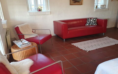 Answald - 250M from the Sea: Furniture, Red, Flooring, Interior Design, Couch, Floor, Living Room, Home, Room
