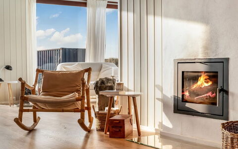 Kiina - 100M from the Sea: Hearth, Wood-Burning Stove, Wood Flooring, Natural Material, Hardwood, Fireplace, Wood Stain, Chair, Living Room, Laminate Flooring
