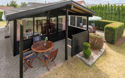 Siem - 650M from the Sea: Door, Roof, Porch, House, Home, Awning, Cottage, Shade, Siding, Deck