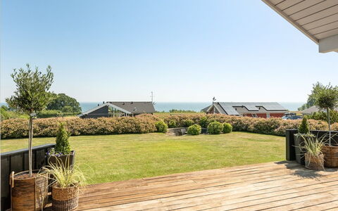 Fridtjof - 100M from the Sea: Sky, Shade, Deck, Ocean, Eco Hotel, Hardwood, Plank, Walkway, Wood Flooring, Landscaping