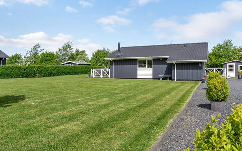 Gustava - 700M from the Sea: House, Roof, Home, Cottage, Lawn, Siding, Garden, Yard, Landscaping, Shade