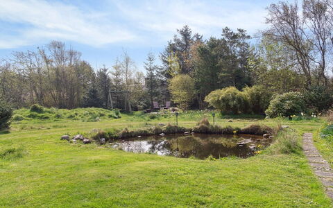 Sune - 500M from the Sea: Roof, House, Home, Cottage, Siding, Estate, Driveway, Garden Buildings, Yard, Shed